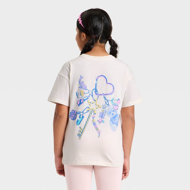 Girls' Short Sleeve Oversized 'Charm' Graphic T-Shirt - Cat & Jack™ Cream XXL Plus