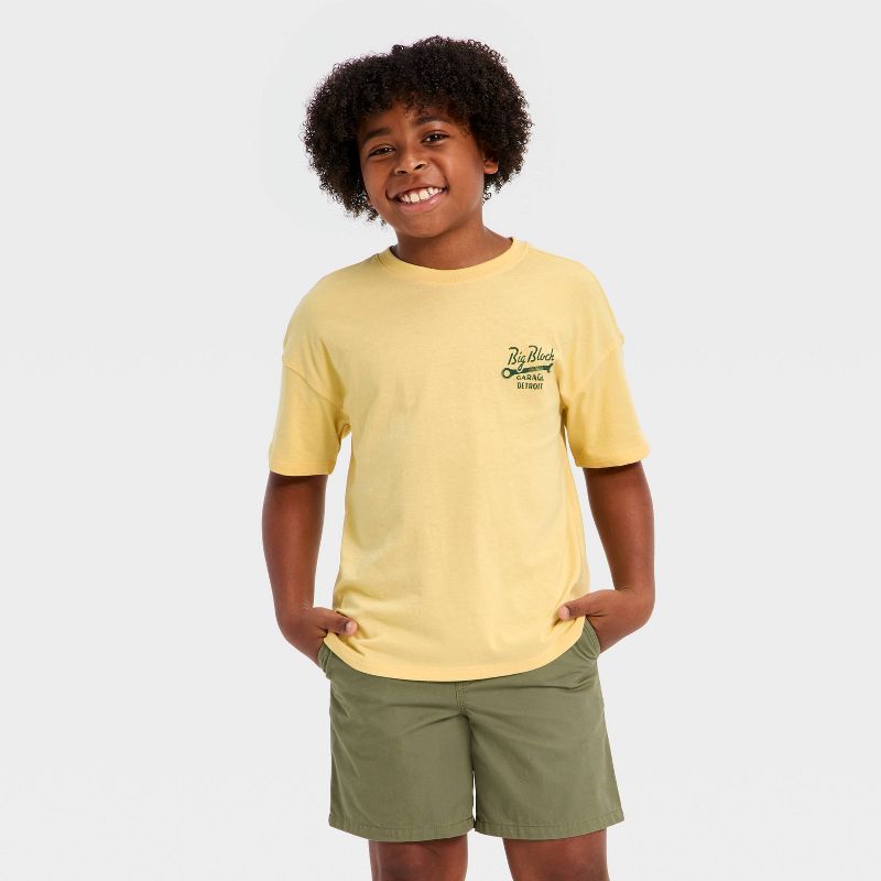 Boys' Short Sleeve Oversized Garage Graphic T-Shirt - Cat & Jack™ Light Gold M