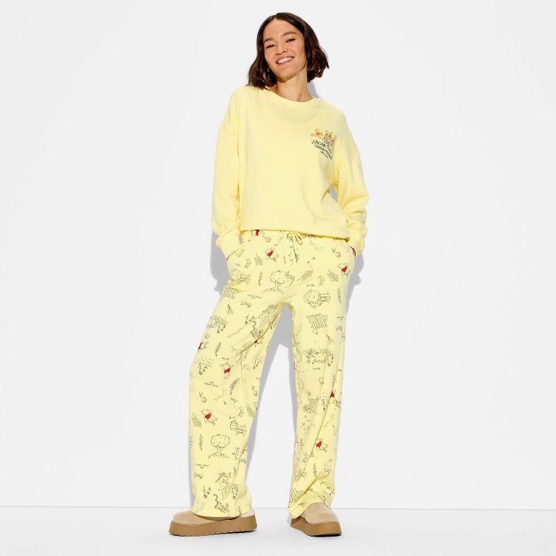 Women's Winnie The Pooh Fleece Graphic Sweatpants - Honey Yellow M